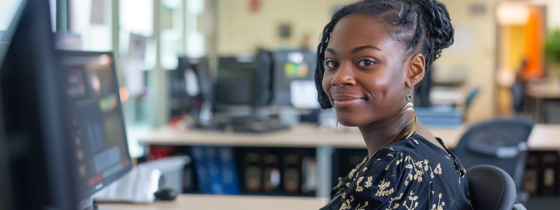 a person sitting quietly at a desk, with a reassuring smile from a proctor at the dmv testing center.