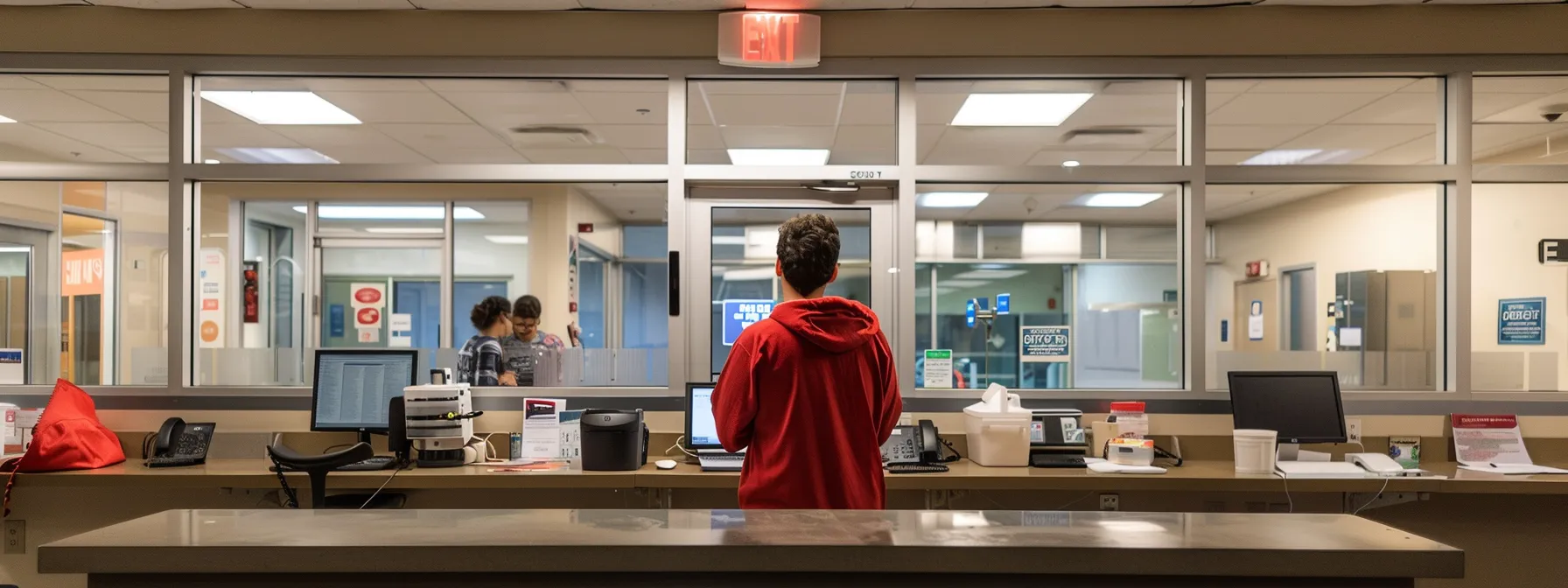 a person at the dmv counter selecting the option to become an organ donor while waiting to schedule a road test.